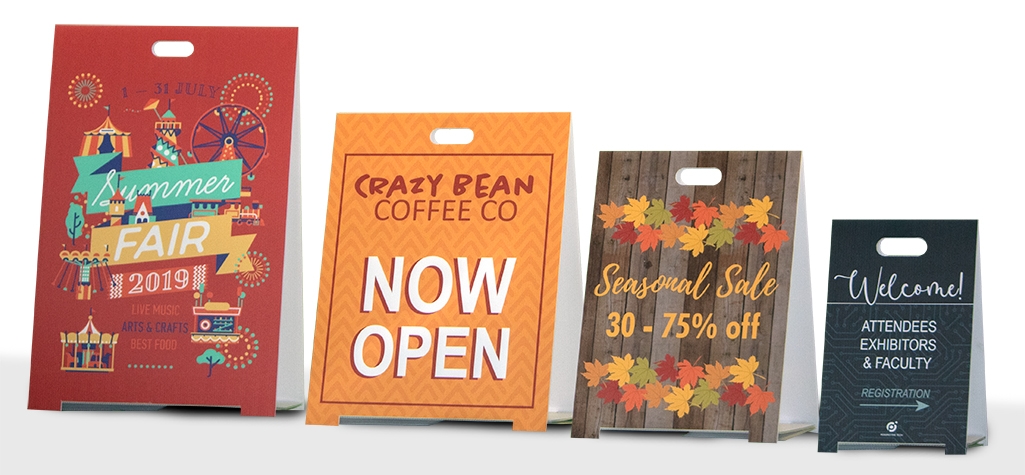 Variety of coroplast sidewalk signs displayed in a row from smallest to largest