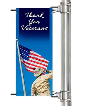 Veteran's Day Pole Banner showing soldier saluting the American Flag | Banners.com